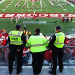 Officers at a football game at Camp Randall Stadium
