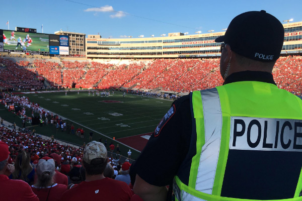 A police officer working at a Badger Football game.