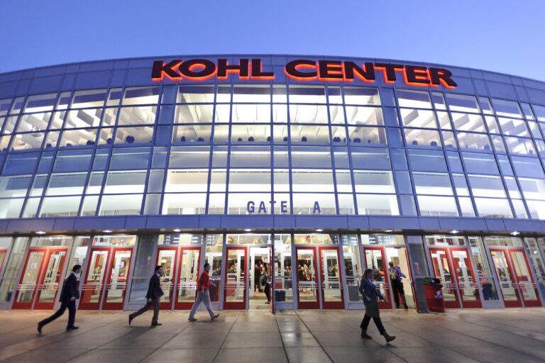 Exterior photo of the Kohl Center at dusk